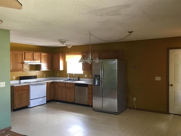 Eat-in kitchen off living room.