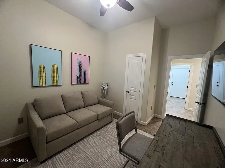 Extra space with desk, couch, and tv