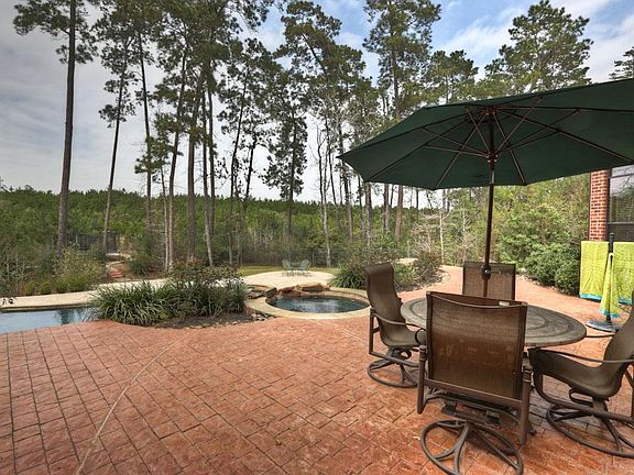 Backing up to a berm hill green space, the views are spectacular.  The serenity and privacy make for a peaceful respite from the daily grind.