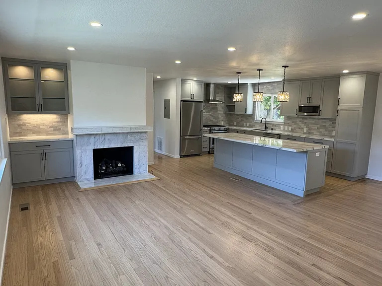 Kitchen, living room, and gas fireplace