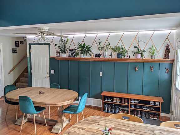 Plant wall, door to garage, stairs to 2nd floor