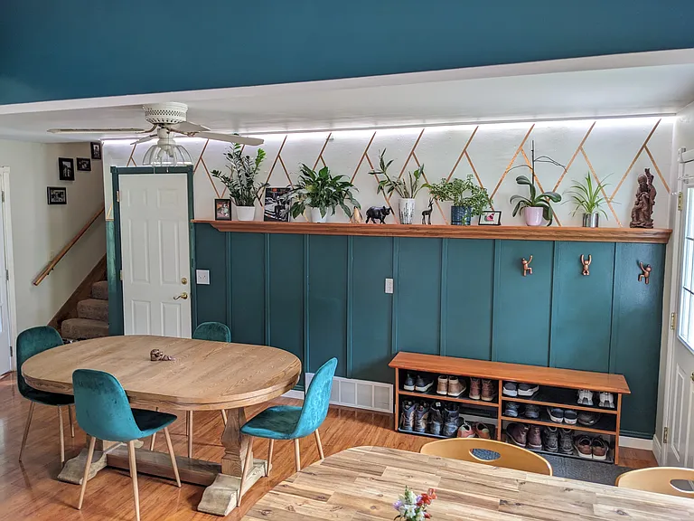 Plant wall, door to garage, stairs to 2nd floor