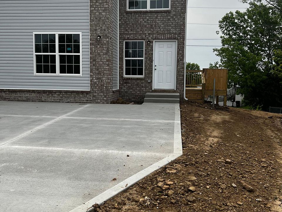 Right side: 113 Judy Ct, picture taken before sod and fence put in.