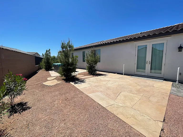 Expansive side yard with raised spa.