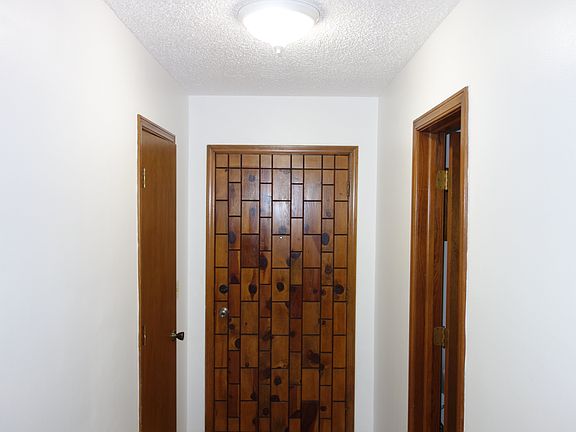 Entry with coat closet on the left and half bath on the right.
