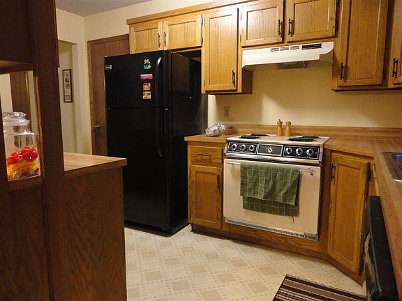 Kitchen has entry from the garage.  All appliances remain. Seller is buying a home warranty for buyer.