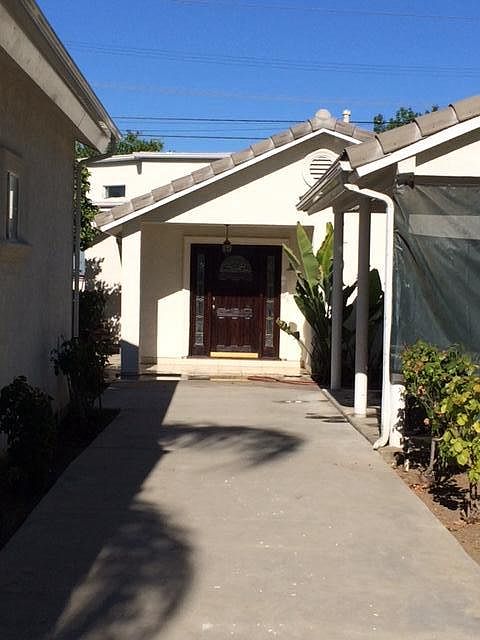 Front of house + covered patio