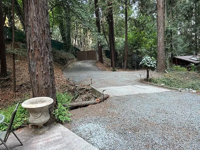 Privacy fence/screen and locking gate at property entrance