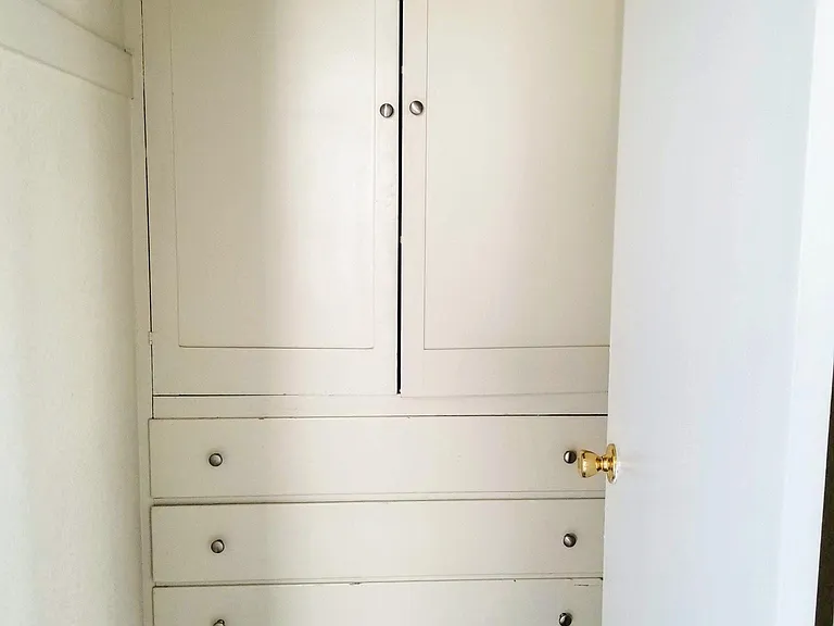 Closet storage room with built in cabinets