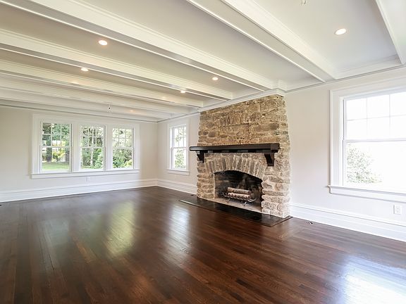 Living room with original stone fireplace