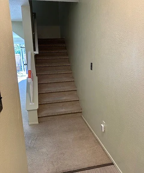 As soon as you enter, kitchen on left, stairs heading up.