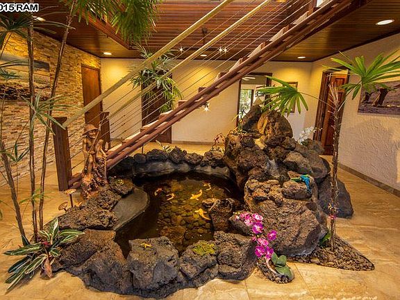 Downstairs Waterfall Terrarium Pond Room. 
From Left to Right:
Door #1 Goes to Garage
Door#2 Goes to Laundry Room
Door#3 Goes to Bedroom 
Door#4 Goes to the Ohana Room with Sofa Bed
 (this is the 4th bdrm and private quarter of the house)