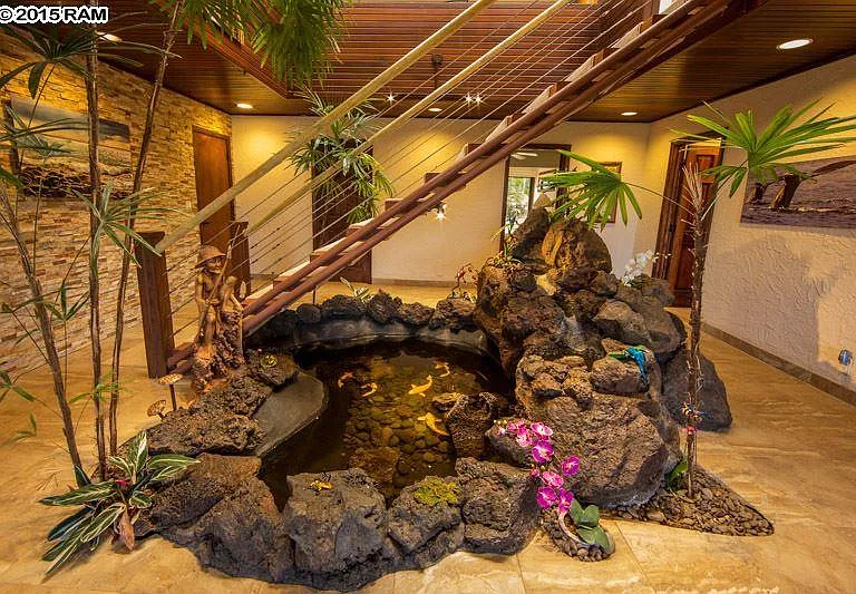 Downstairs Waterfall Terrarium Pond Room. 
From Left to Right:
Door #1 Goes to Garage
Door#2 Goes to Laundry Room
Door#3 Goes to Bedroom 
Door#4 Goes to the Ohana Room with Sofa Bed
 (this is the 4th bdrm and private quarter of the house)
