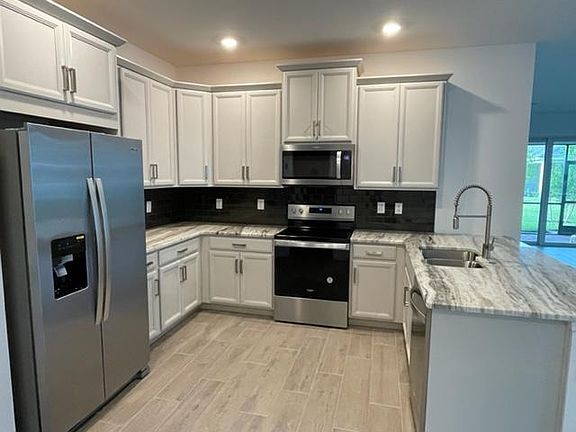 Upgraded kitchen package with beautiful countertops.
