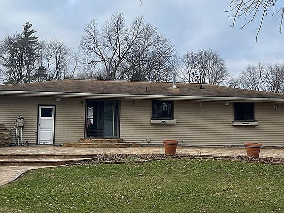 Back of house w/stone patio