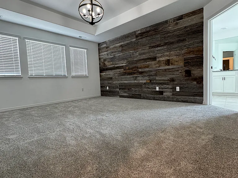 Master bedroom- reclaimed wood wall