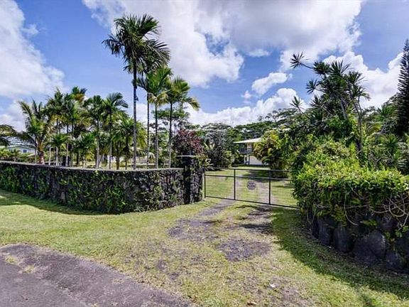 Rock wall with automatic gate