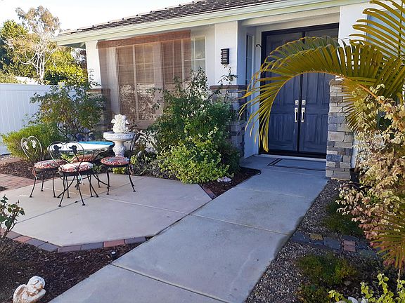 Private fenced front entry with RING cameras