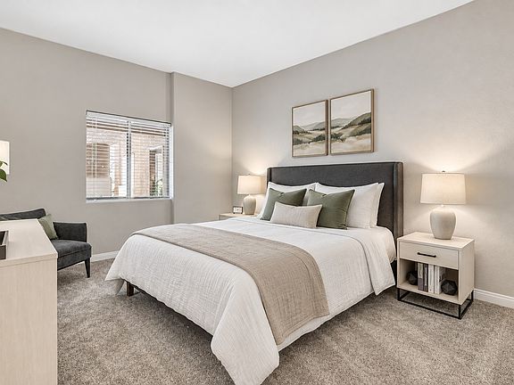 Step into the serene elegance of Eagle Trace with this beautifully designed bedroom, featuring plush furnishings and a calming palette. Perfect for relaxation after a long day. Schedule your tour now and see it for yourself!