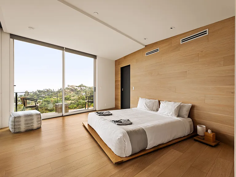 Exclusive Los Angeles bedroom suite at Merkaba Home. Sleek modern design, expansive windows, and serene Laurel Canyon surroundings define luxury living.