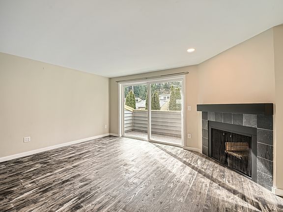 Living room with fireplace connect to Balcony area