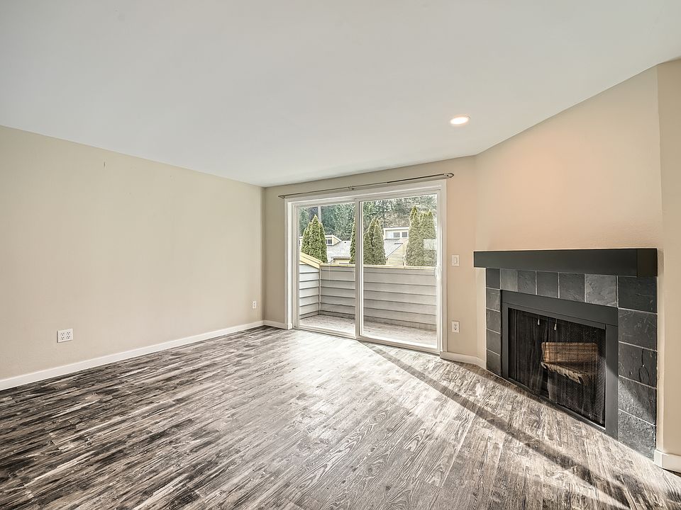 Living room with fireplace connect to Balcony area