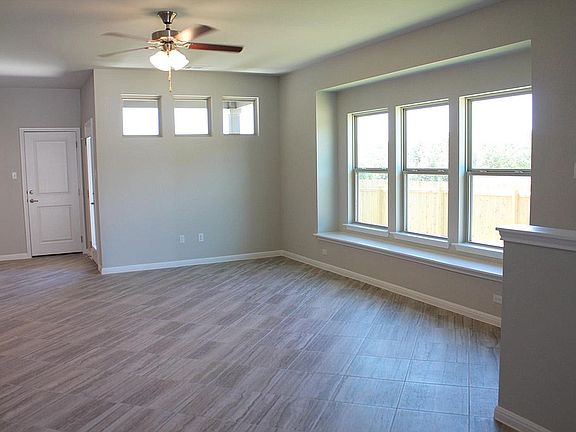 Spacious Living room with Boxed windws and natural light.