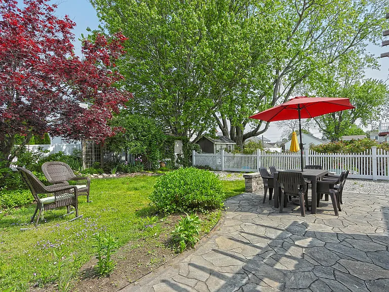 Rear yard with several areas to sit and relax.