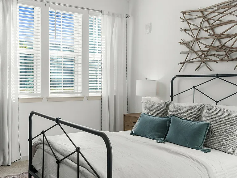 Experience relaxation in this beautifully sunlit bedroom.