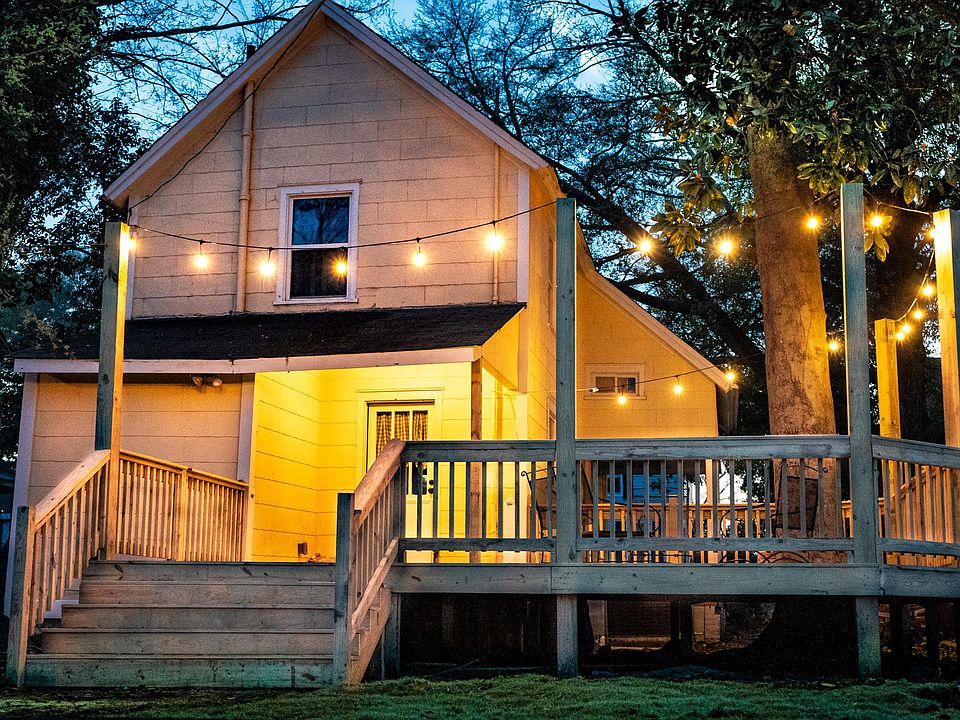 Massive 400 sq ft deck.....with party lights wrapping around huge old magnolia tree