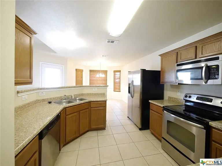 Bright open kitchen with counters for lots of working & cooking.