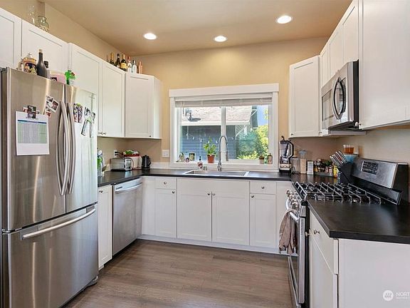 kitchen with new appliances and stone counter