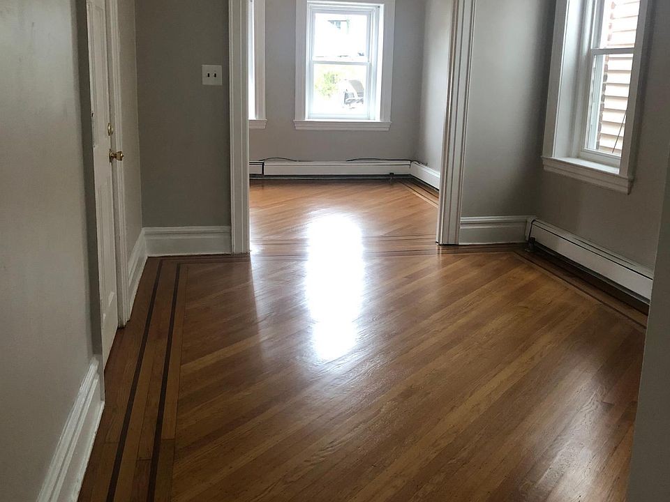 Entrance into your Dining Room looking into your Living Room Freshly painted, branch new efficient and warm windows, just redone hardwood floors!