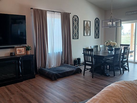 LIVING ROOM OPENS TO DINING ROOM