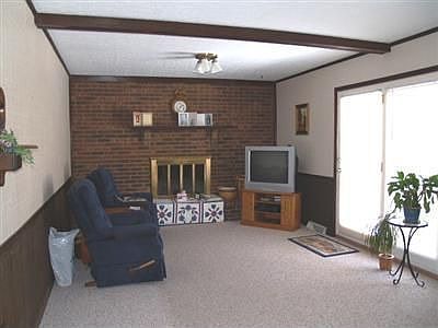 Family room with fireplace and door to patio
