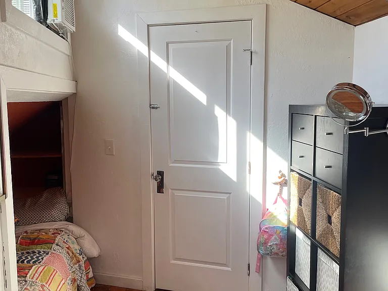 upstairs bedroom door leading to loft