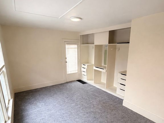Main living/bedroom area - backdoor entrance