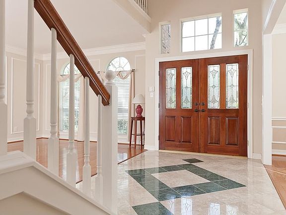 Entry has marble tiles with decorative pattern.