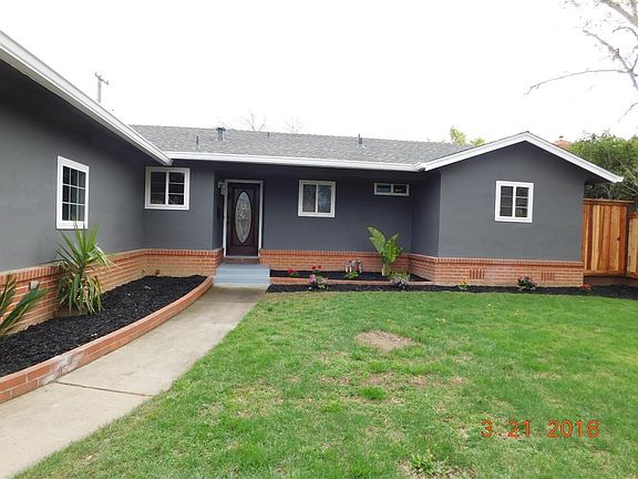 Leaded glass front door greets you when coming up the walkway.   Landscaping just redone. Auto sprinklers front and rear.  All new Fencing! Nice size flower beds to add your own touch! Neat and Clean!