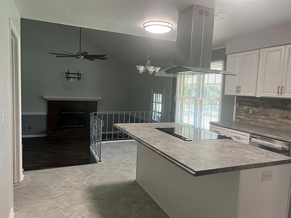 Kitchen overlooks the sunken family room.