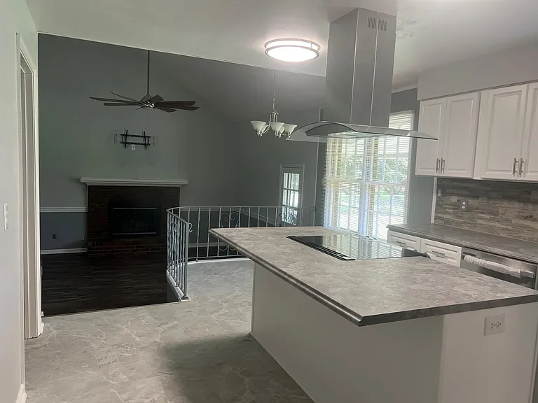 Kitchen overlooks the sunken family room.