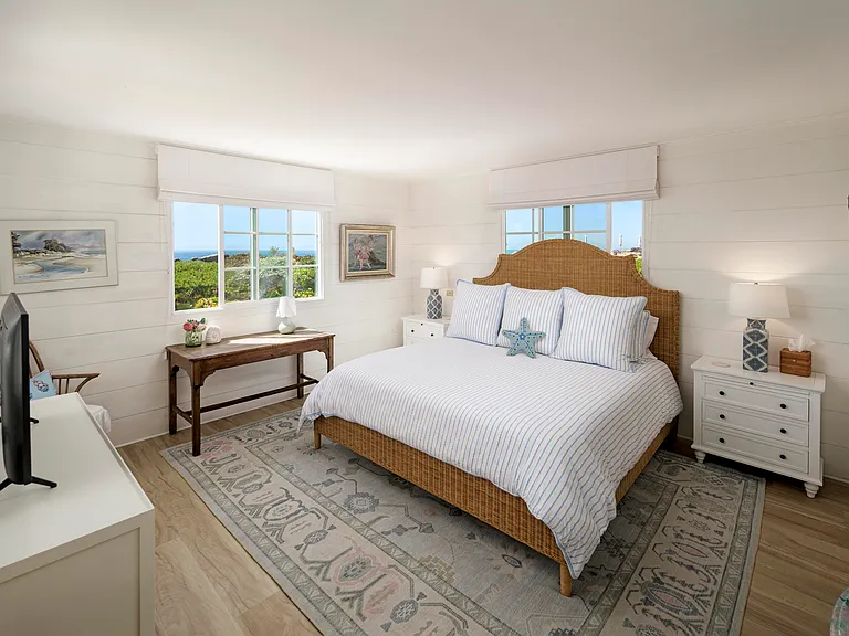 Primary Bedroom with new king size bed and new Tempur-Pedic mattress. New 9 drawer dresser. Writing desk with ocean views. Flat screen tv.