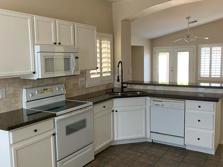Granite countertops. Stainless steel sink. New dishwasher, microwave, oven/stove and refrigerator.