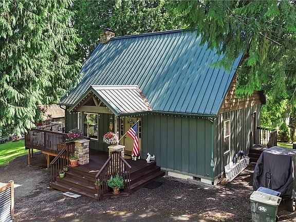 The front porch wraps around onto the large deck.