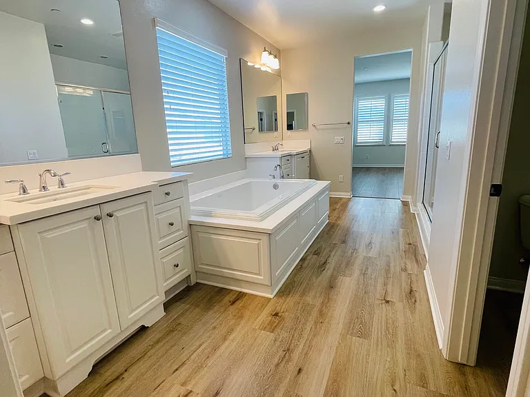 Master Bathroom with Jacuzzi tub, large separate shower and toilet room (taken from closet).