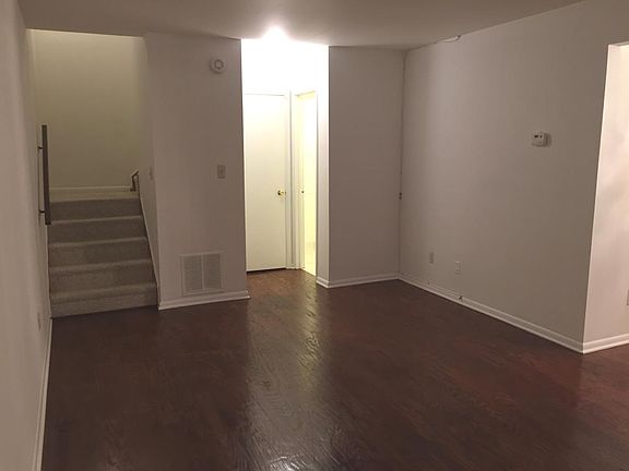 Living room with coat closet, half bath, and storage area