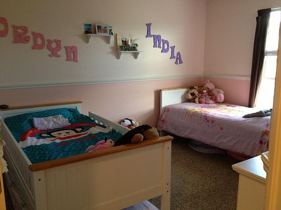 one of three bedrooms