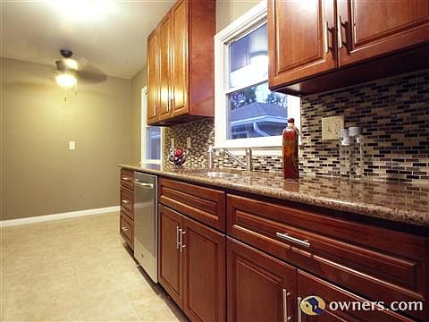 Check out the granite countertops and glass tile detail.