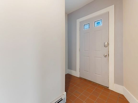 Entry door from inside the apartment. Private entry to the unit. There are 2 other units in the building that have a separate entry.