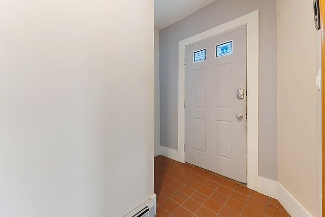 Entry door from inside the apartment. Private entry to the unit. There are 2 other units in the building that have a separate entry.